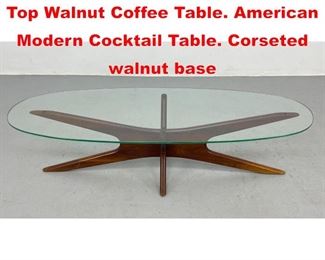 Lot 105 ADRIAN PEARSALL Glass Top Walnut Coffee Table. American Modern Cocktail Table. Corseted walnut base 