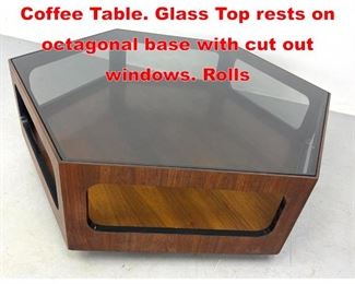 Lot 115 LANE Hexagonal Cocktail Coffee Table. Glass Top rests on octagonal base with cut out windows. Rolls 