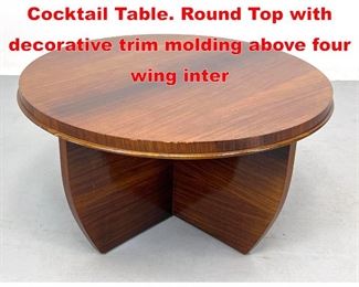 Lot 144 Art Deco style Designer Cocktail Table. Round Top with decorative trim molding above four wing inter