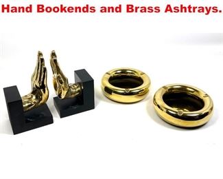 Lot 224 Global Views Lot. Gold Hand Bookends and Brass Ashtrays. 