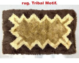 Lot 292 Wool brown and tan shaggy rug. Tribal Motif. 