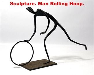 Lot 311 Modernist Metal Figural Sculpture. Man Rolling Hoop. 