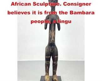 Lot 323 50 inch Carved Standing African Sculpture. Consigner believes it is from the Bambara people, a lingu