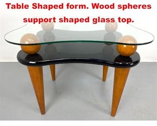 Lot 362 Modernist Artisan Side Table Shaped form. Wood spheres support shaped glass top. 