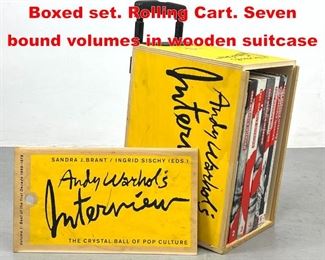 Lot 371 Andy Warhol s Interview Boxed set. Rolling Cart. Seven bound volumes in wooden suitcase