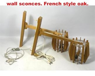 Lot 418 Pair European adjustable wall sconces. French style oak. 