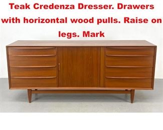 Lot 544 FALSTER Danish Modern Teak Credenza Dresser. Drawers with horizontal wood pulls. Raise on legs. Mark