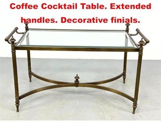 Lot 572 Regency style Glass Top Coffee Cocktail Table. Extended handles. Decorative finials. 