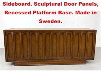 Lot 596 Modern Teak Credenza Sideboard. Sculptural Door Panels, Recessed Platform Base. Made in Sweden.
