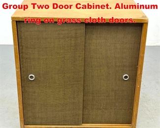 Lot 604 Paul McCobb Planner Group Two Door Cabinet. Aluminum ring on grass cloth doors. 