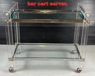 Lot 609 Chrome and lucite 1970s bar cart server. 