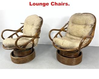 Lot 653 Pair Rattan Swivel Lounge Chairs. 