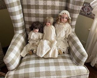 Second of pair wing back chair, photographed with antique porcelain dolls