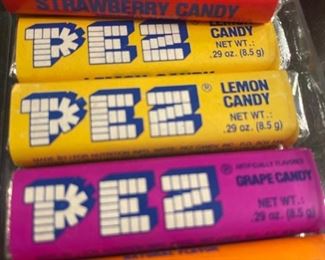 WE HAVE AN ORIGINAL PEZ STAND AND SEVERAL IN PACKAGE PEZ DISPENSERS AND CANDIES!