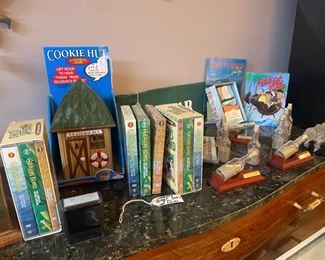 GILLIGAN'S ISLAND DVD'S, TAPES, BOOKS & A MUSICAL COOKIE JAR THAT PLAYS THE THEM TO GILLIGAN'S ISLAND WHEN "ROOF" IS TIPPED OPEN... We also have an original typed out lyric sheet of the theme song!