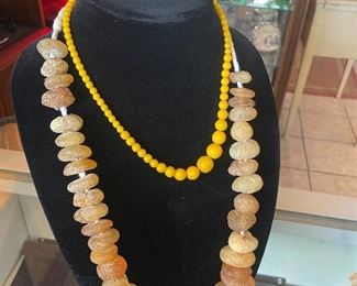 Raw Amber necklace. Inside smaller graduated yellow beaAmber? Both from Hollywood Hills estate.