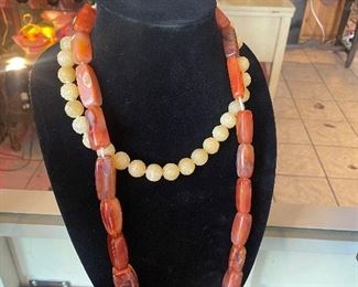 Beautiful vintage necklaces! Amber? Smaller round beaded necklace is carved and very heavy...
