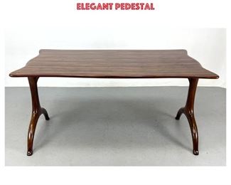 Lot 709 Designer Exotic Wood Dining Table. Desk Table. Sculptural shaped top above pair of elegant pedestal 