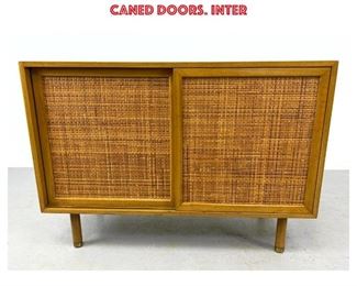 Lot 862 HARVEY PROBBER American Modern Sliding Door Cabinet. Walnut Cabinet with Pr Woven Caned Doors. Inter