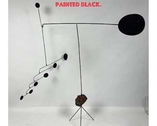 Lot 1096 Kinetic Metal Standing Mobile Sculpture. Tripod base with real rock element. Metal painted black. 