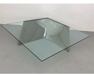 Lot 1273 J. Wade Beam Breuton Coffee Table. A chrome and glass cantilevered coffee table 