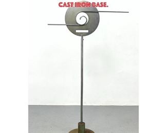 Lot 1403 Tall Art Deco inspired Metal Floor Sculpture. Disc with decorative elements. Heavy cast iron base. 