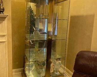 Featured picture is one of two gorgeous display cabinets. Heavy brass and glass. panels open from side. 