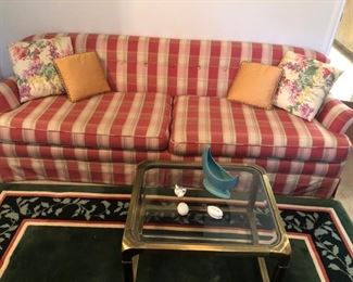 Lovely two-cushion stripe sofa and brass coffee table