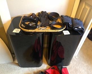A pair of black display pedestals and mens accessories