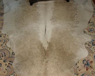 Tan & White Cowhide Rug. 