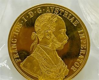 Large selection of gold and palladium coins.