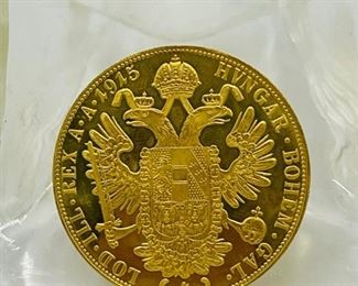 Large selection of gold and palladium coins.