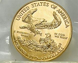 Large selection of gold and palladium coins.