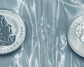 Large selection of gold and palladium coins.