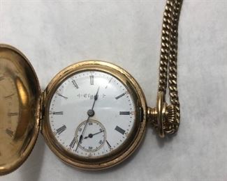 Ladies gold filled hunter pocket watch. Floral decoration. Comes with 22" gold filled chain. Works!