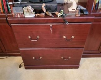 This is a wooden filing cabinet that matches the two bookcases.  In wonderful condition.