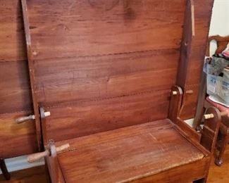 Up right with bench which opens for storage.  