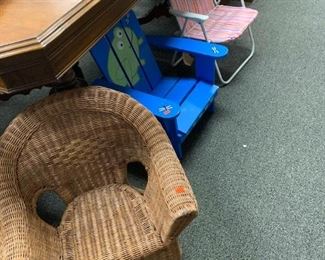 Toddler's wicker chair, frog Adirondack chair and small folding lawn chair. 