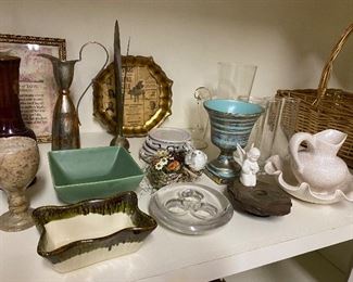 Vintage pottery, glassware and additional home decor throughout the condo.