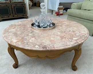 Vintage coffee table with marble top.