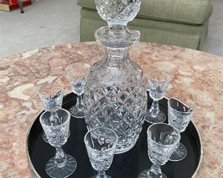 Waterford decanter (chipped) with eight glasses and tray.
