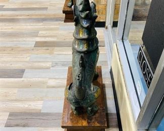 $7199 Pair of Antique Bronze Thai Foo Dog Statues Jade Amethyst Rose Quartz For inquiries about the listing or if you are selling your gold or silver, please text or call 7032689529 or visit the Tysons Jewelry Store at 8373 Leesburg Pike #12, Vienna Virginia 22182 This pair of antique 20th century 1900 bronze life size Tony Duquette style Thai foo dog statues encrusted with jade amethyst rose quartz on the ears, neck, chest and legs shown are available for local pickup.
Statue Dimensions:
Height: 35 in (88.9 cm)
Width: 28 in (71.12 cm)
Depth: 12 in (30.48 cm)
Wood Pedestal Dimensions:
Height: 8.5 in (21.59)
Width 13.5 in (34.29)
Depth 12 in (30.48 cm)