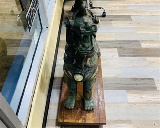 $7199 Pair of Antique Bronze Thai Foo Dog Statues Jade Amethyst Rose Quartz For inquiries about the listing or if you are selling your gold or silver, please text or call 7032689529 or visit the Tysons Jewelry Store at 8373 Leesburg Pike #12, Vienna Virginia 22182 This pair of antique 20th century 1900 bronze life size Tony Duquette style Thai foo dog statues encrusted with jade amethyst rose quartz on the ears, neck, chest and legs shown are available for local pickup.
Statue Dimensions:
Height: 35 in (88.9 cm)
Width: 28 in (71.12 cm)
Depth: 12 in (30.48 cm)
Wood Pedestal Dimensions:
Height: 8.5 in (21.59)
Width 13.5 in (34.29)
Depth 12 in (30.48 cm)