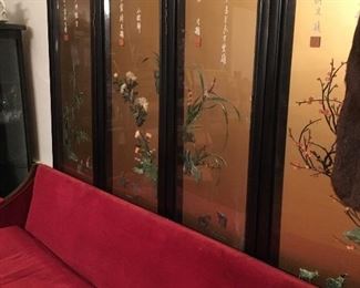 Oriental screen and vintage red velvet sofa