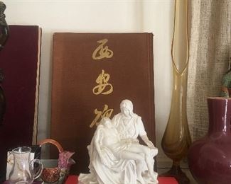 Bisque statues and early books.