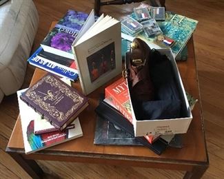 Coffee table books, mid century modern table, crocodile handmade  shoes. 
