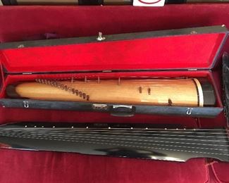 5 ft Japanese Koto with 18 Strings. Has case and tuning key. 