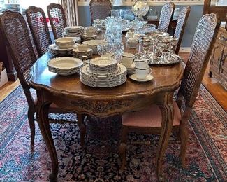 dining table with 8 cane back chairs