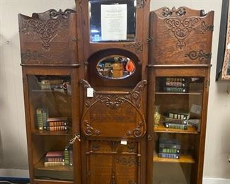 c.1872-1905, Large Mahogany Secretary-Bookcase, Custom Designed and Made fora Judge in Parkersburg, WV and delivered in 1903. Everything about this one-of-a-kind antique is EXQUISITE! It has large molded and curved wrought iron hinges, handmade just for this one piece of "ART!" The middle drawer, when opened, is accented with a scalloped edge that can only be seen when opened. This piece is AMAZING! It is even mounted on 8 casters, so it can be moved fairly easily; however, this is a heavy piece and will require special effort when moving to its final destination. 