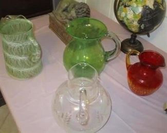 FOUR glass pitchers